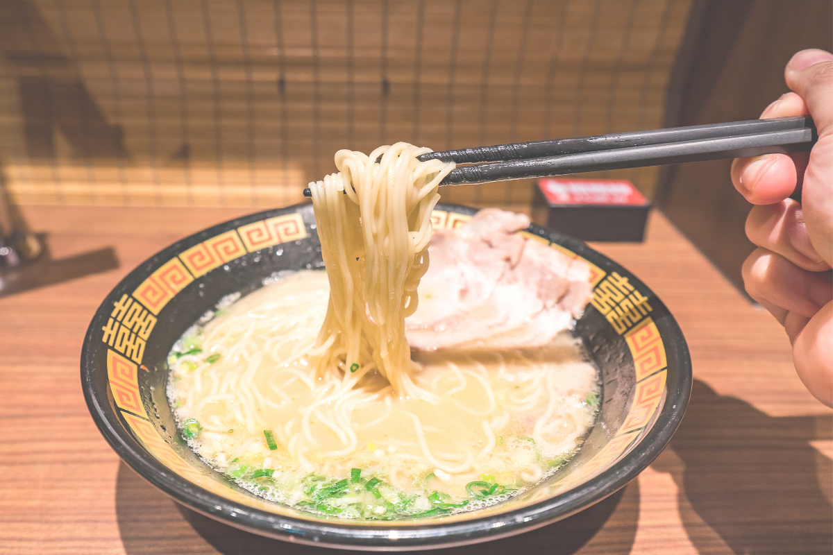 A bowl of ramen on the counter at a ramen restaurant in Japan
