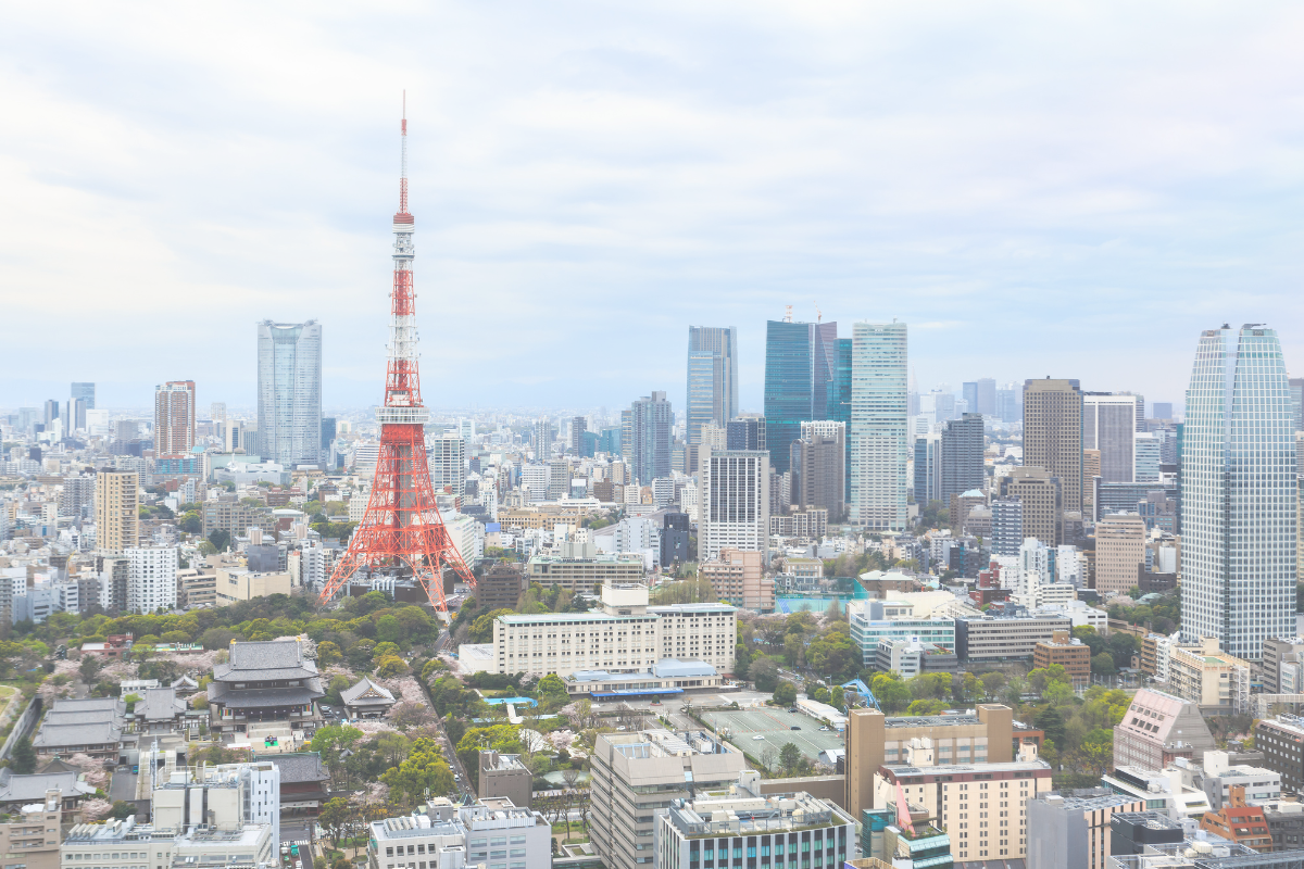 Tokyo Tower rising above the surrounding city buildings