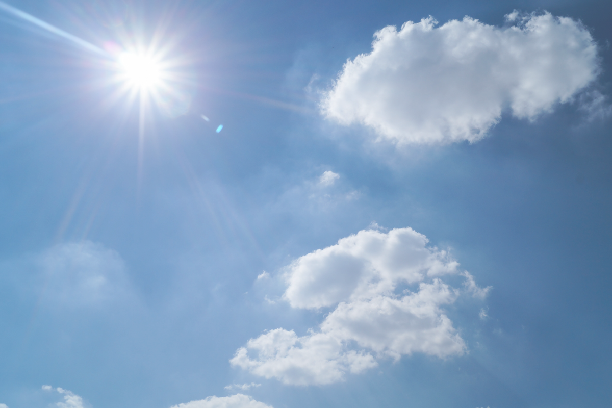 Blue sky with bright sunshine and white clouds