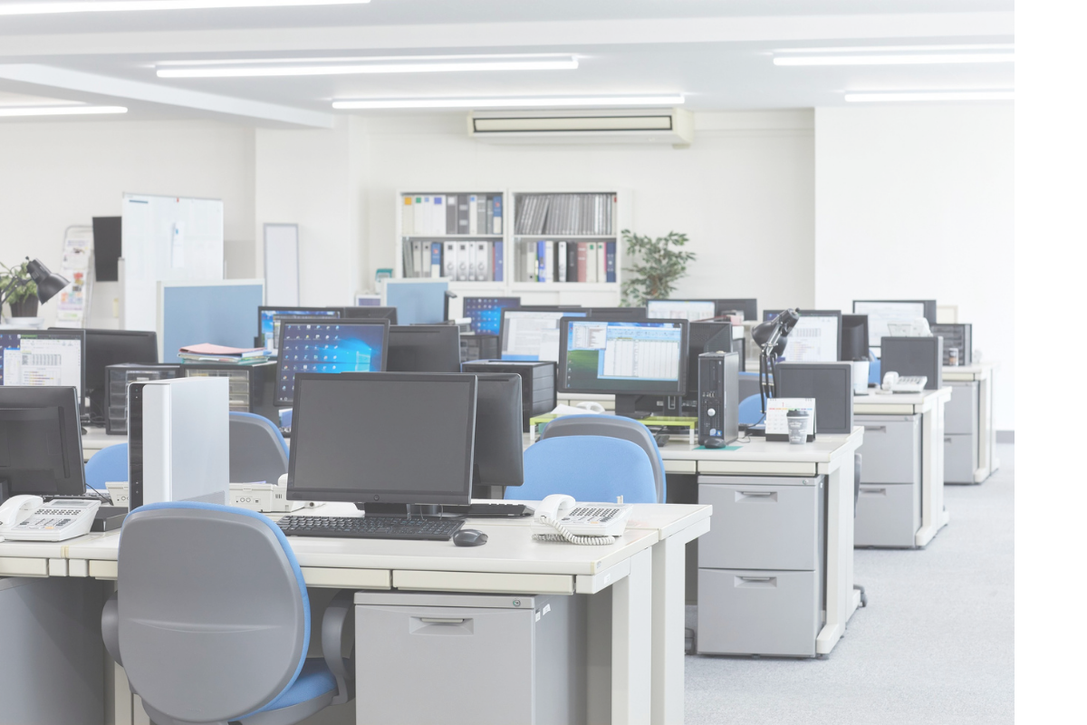 Office with desks, computers, and chairs